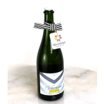 Bottle of sparkling wine with a striped ribbon and floral tag
