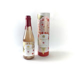 Two bottles of Hidden Rose apple cider, one in a decorative tube