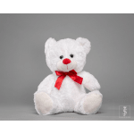 White teddy bear with a red ribbon on a gray background