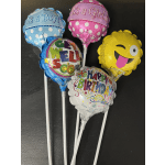 Five novelty balloons on sticks, including baby and birthday messages