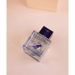 A square perfume bottle with a dark cap on a pale pink background.