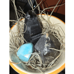 Small bowl holding crystals and air plants