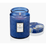 Blue glass candle jar with a patterned lid