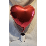 Red heart-shaped foil balloon with a white ribbon spool