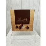 Box of Lindt gourmet truffles on a clear stand