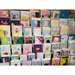 Display rack filled with assorted greeting cards in many colors.