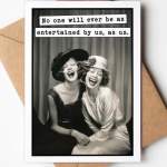 Greeting card with a black-and-white photo of two laughing women and a caption