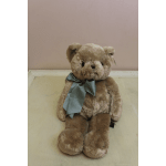 Plush teddy bear with a ribbon around its neck