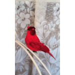 Red decorative bird perched on curved white rods