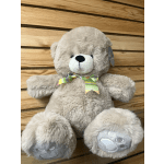 Plush teddy bear with a striped ribbon bow