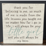 Wooden sign with a sentimental quote in black and teal text