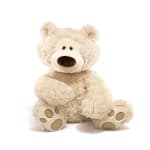 Cream teddy bear plush sitting on a white background