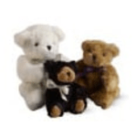 Three teddy bears in white, black, and brown sit together.