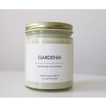 Gardenia soy wax candle in a glass jar with a gold lid