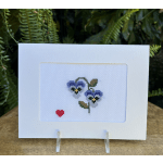Cross-stitch card with two purple pansies and a small red heart