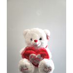 White teddy bear holding a red heart with "I Love You" text