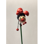 Decorative ladybug pick on a green stem