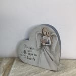 Heart-shaped memorial plaque with an angel and the words "Forever and Always in our Hearts"