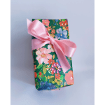 Floral-patterned gift box tied with a pink ribbon