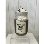 Coffee-scented candle in a glass jar topped with whipped wax and coffee beans