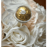 White roses with a Ferrero Rocher chocolate in the center