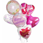 Cluster of pink and white heart-shaped anniversary balloons