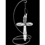 Crystal cross ornament hanging on a silver metal stand