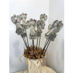 Angel figurines with cardinal accents in a white container