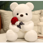 White teddy bear holding a red rose with a black ribbon