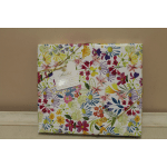 Floral-patterned gift box tied with gold ribbon