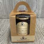 Boxed candle in a kraft paper gift package with a handle