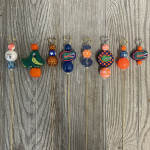 Decorative beaded picks with heart toppers and Florida Gators charms