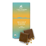 Sea salt toffee milk chocolate bar with teal and yellow wrapper and chocolate squares in front