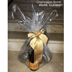 Wrapped Veuve Clicquot champagne bottle with a gold ribbon
