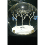 Clear globe with white decorative trees on a snowy base