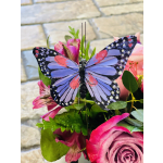 Pink roses and alstroemeria with a decorative butterfly pick