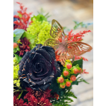 Dark rose bouquet with red flowers and a butterfly decoration