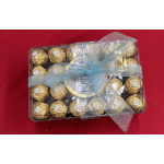 Box of gold-wrapped chocolates tied with a blue ribbon
