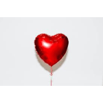 Red heart-shaped balloon on a white background