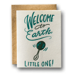 Greeting card reading "Welcome to Earth, Little One!"