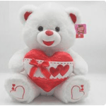 White teddy bear holding a red heart-shaped gift box