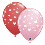 Two heart-patterned balloons, one red and one pink