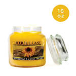 Yellow candle jar with a sunflower label and a clear lid.