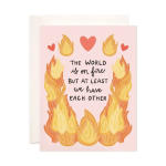 Pink greeting card with hearts and flames around a text message
