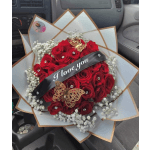 Bouquet of red roses with baby's breath and a black ribbon