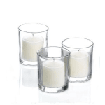 Three white candles in clear glass holders