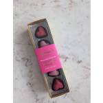 Box of heart-shaped chocolate truffles in pink and dark chocolate