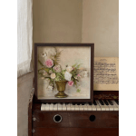 Framed floral arrangement with pink and white roses in a gold vase