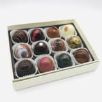Box of assorted chocolate truffles in paper cups
