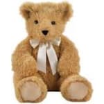 Teddy bear with a white ribbon bow